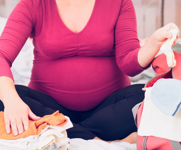 Pregnant mother packing her hospital bag