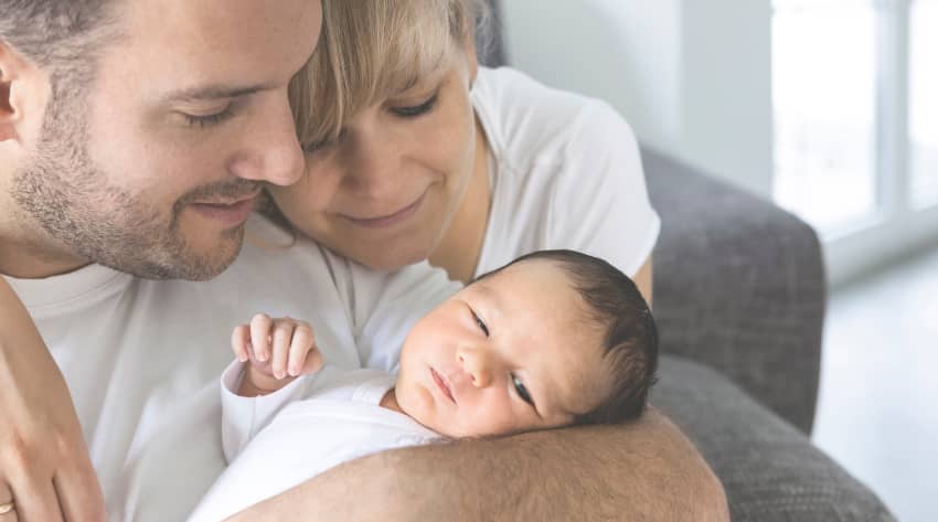 Parents looking lovingly at newborn Parents looking lovingly at newborn