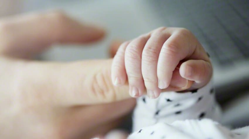 newborn-caring-for-premature-baby-at-home-body_850-1.jpg A newborn child holding their parent’s finger