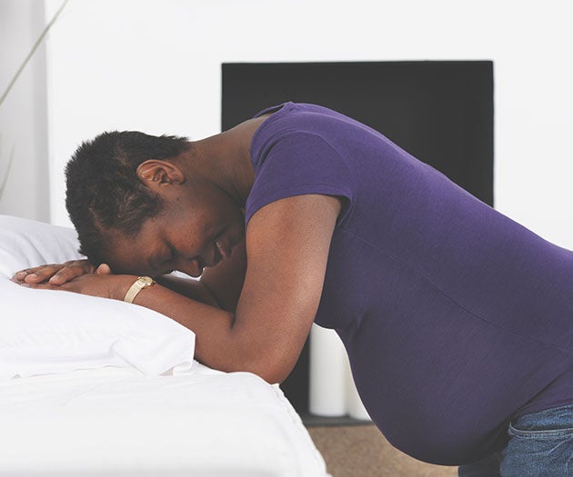 Pregnant mother experiencing contractions and going into labour