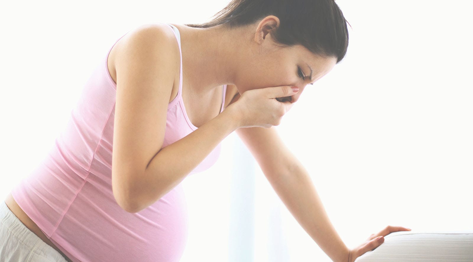 Pregnant mother experiencing morning sickness