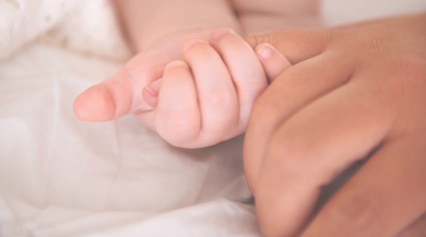 signs-of-labour-body_850-2.jpg newborn baby holding onto mother’s finger