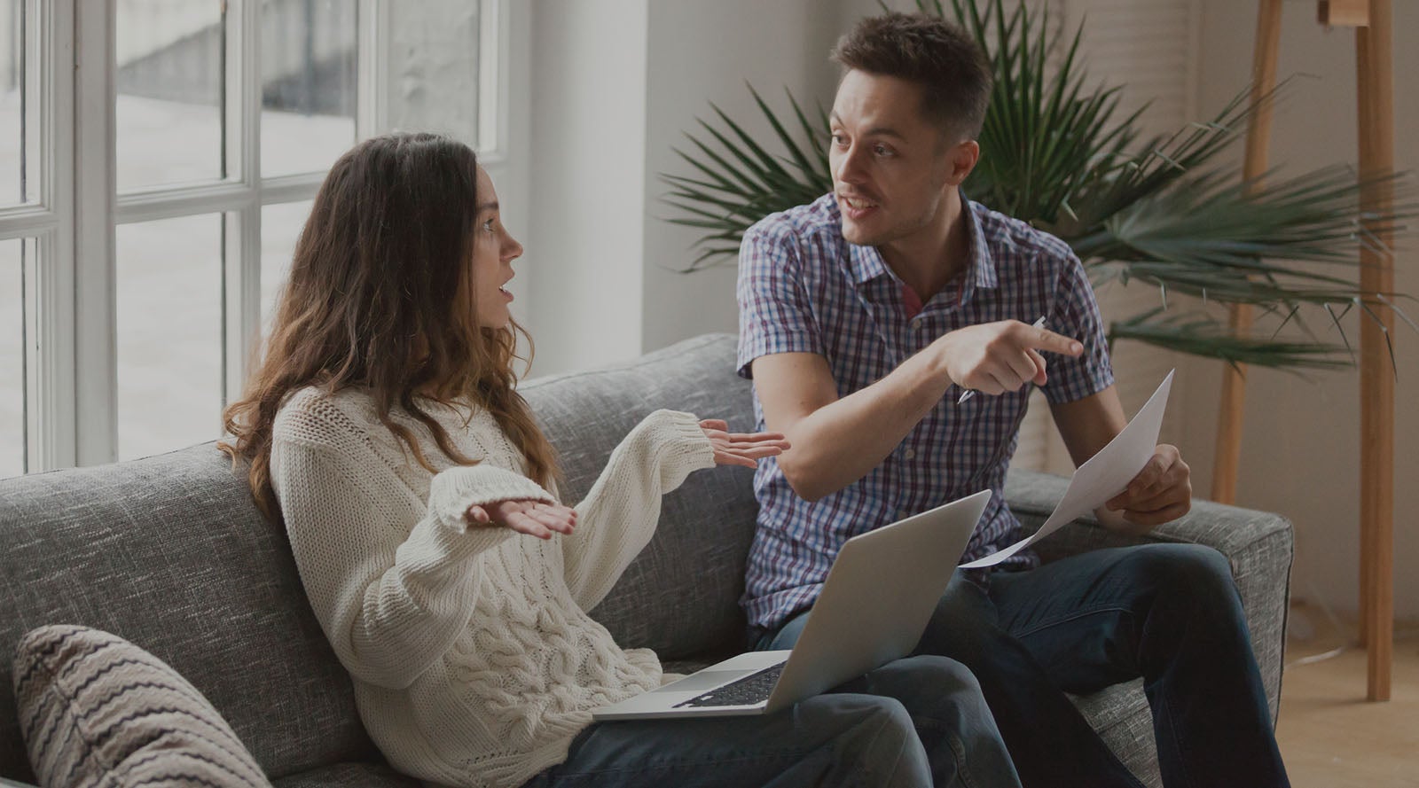 a mother and a father researching and debating on baby names