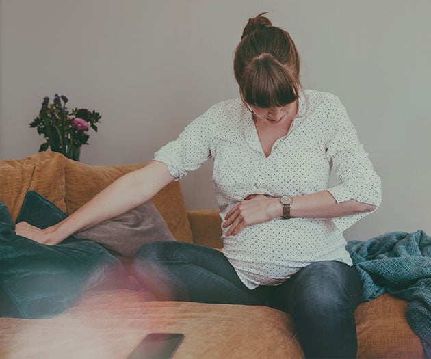 pregnant mother experiencing contractions and about to go into labour