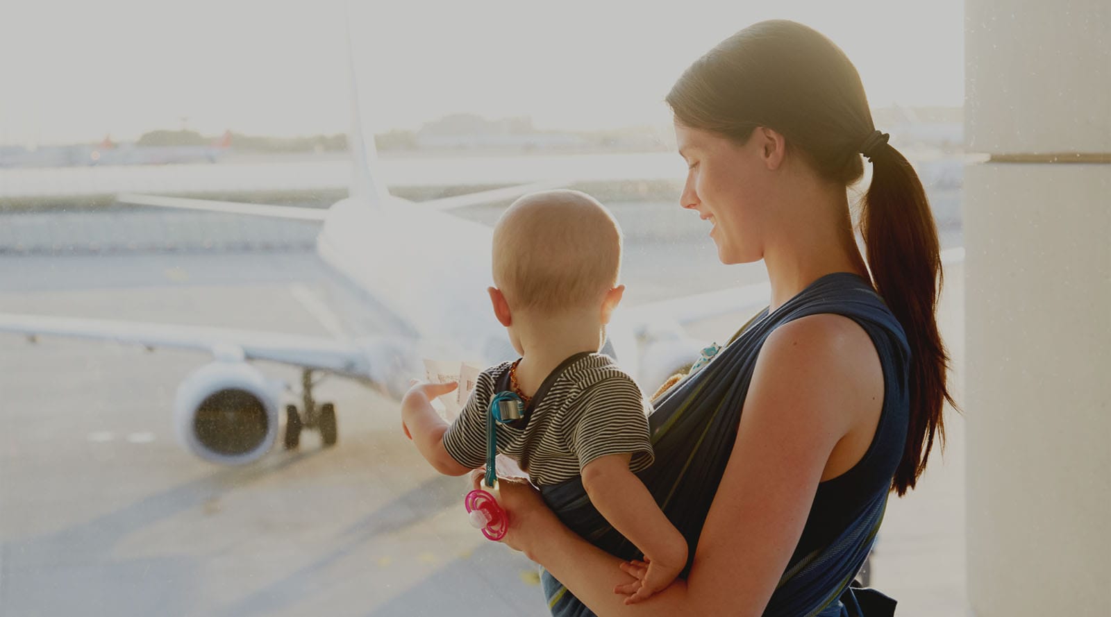 mother travelling with baby at the airport