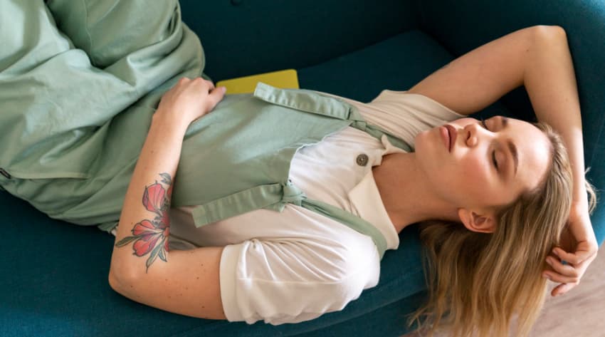 Woman holding belly with early pregnancy cramps Woman holding belly with early pregnancy cramps