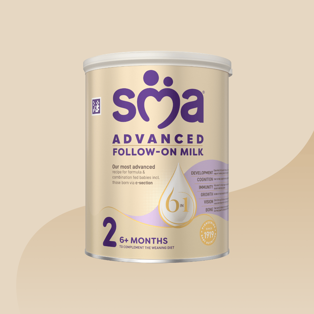 Gold tin of SMA Advanced Follow-on Milk for babies 6-12 months with a grey lid on a gold background