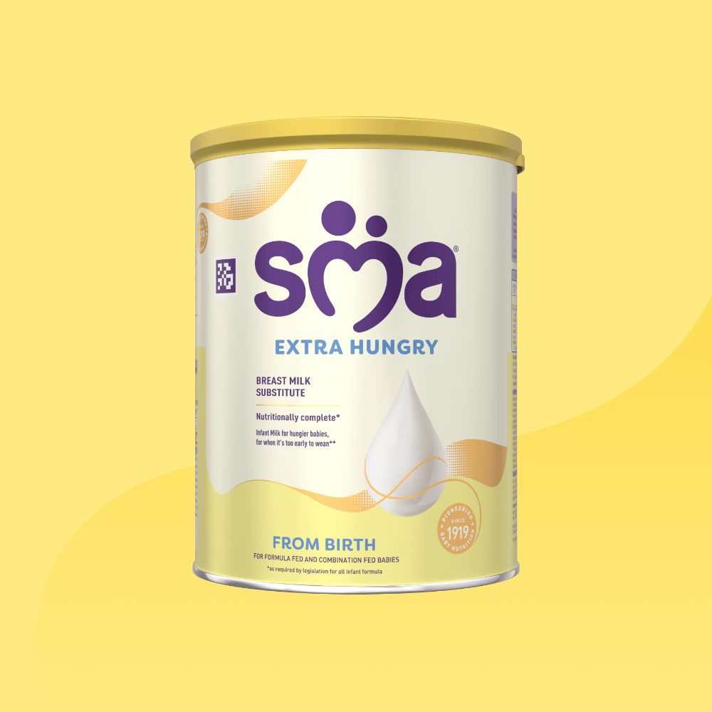 Tin of SMA Extra Hungry Infant Baby Milk with a yellow lid, on a yellow background
