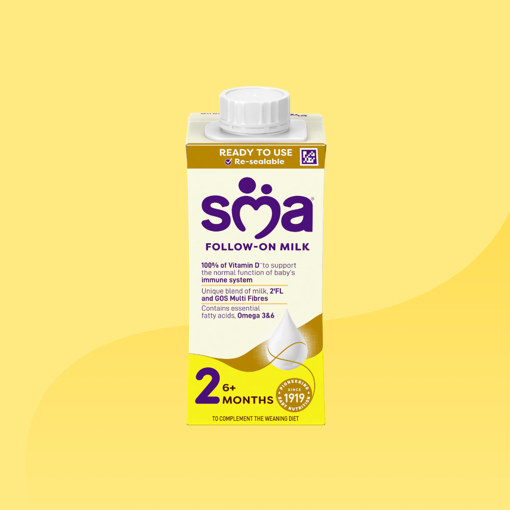 Carton of SMA Follow-on Milk Ready to Drink 200ml for babies 6-12 months, on a yellow background