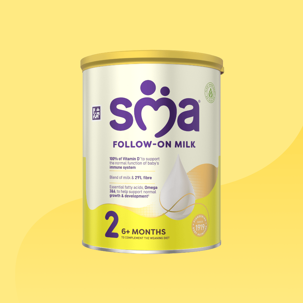 Tin of SMA Follow-on Milk Powder for babies 6-12 months with a yellow lid on a yellow background