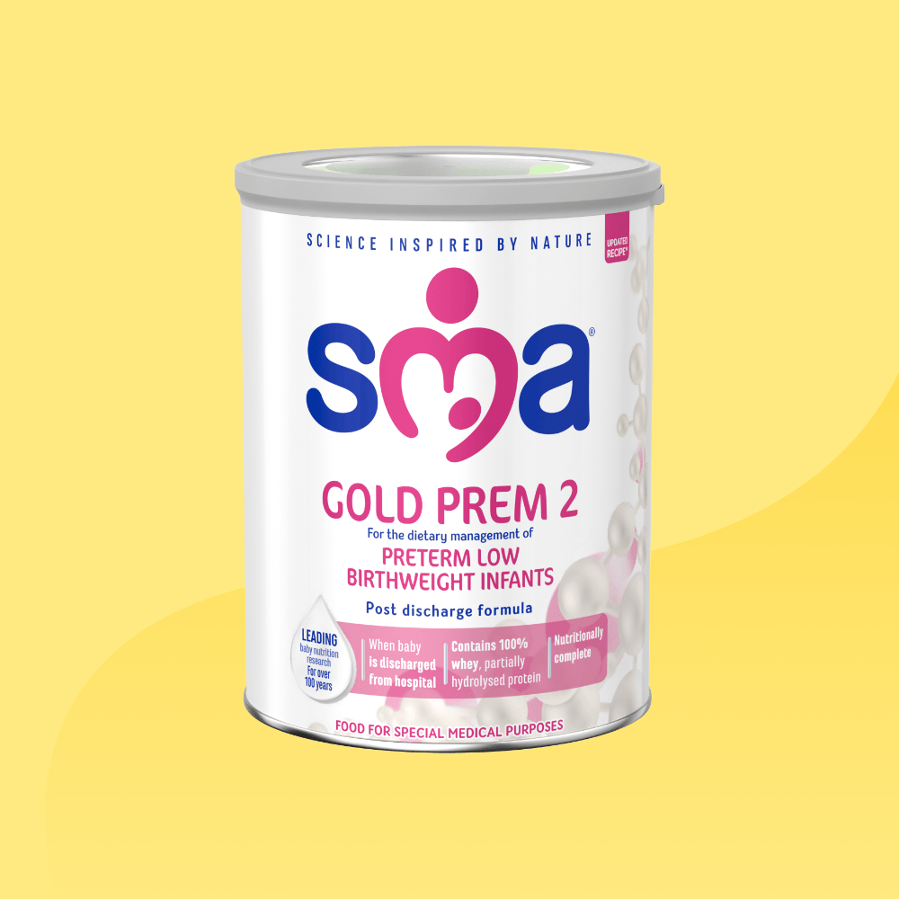 Tin of SMA Gold prem 2 Formula Powder, with a grey lid, in front of a yellow background