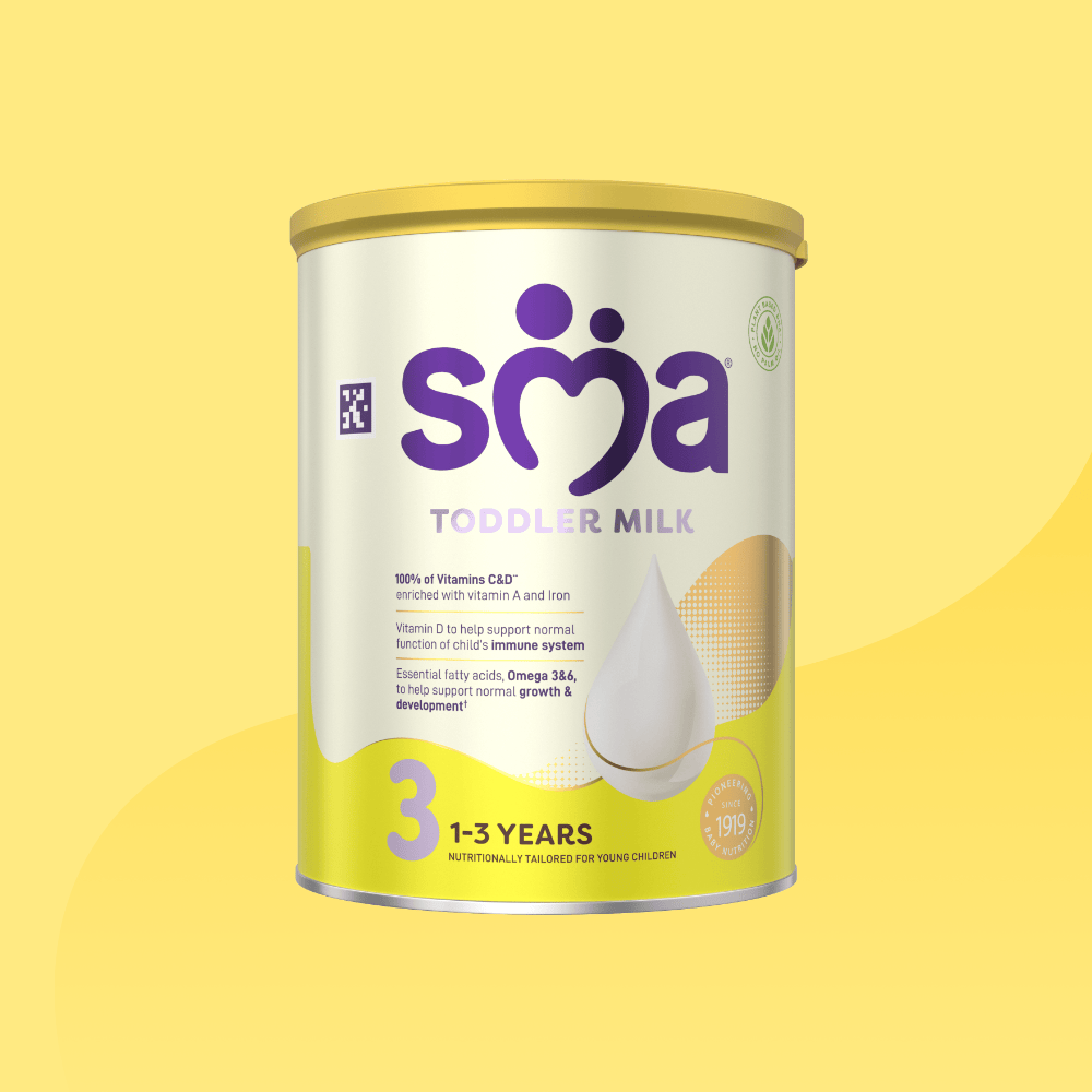 Tin of SMA Toddler Milk Powder for children 1 to 3 years, on a yellow background.